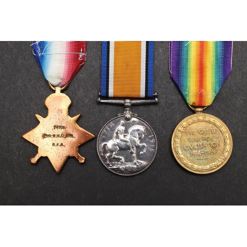 1244 - A FIRST WORLD WAR TRIO TO THE ROYAL FIELD ARTILLERY. A Great War Trio comprising 1914 Star with clas... 