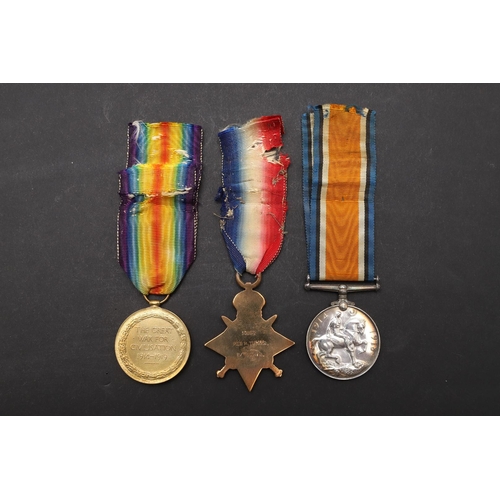 1245 - A 1914 TRIO TO A CASUALTY WITH THE WELSH REGIMENT. A Great War Trio comprising 1914 Star with '5th A... 