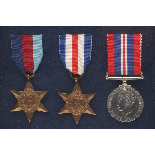 1302 - A FRAMED COLLECTION OF SECOND WORLD WAR MEDALS. A collection of medals comprising 1939-45 Stars (2) ... 