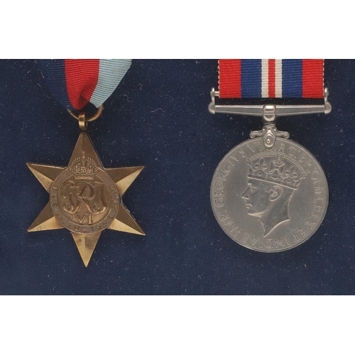 1302 - A FRAMED COLLECTION OF SECOND WORLD WAR MEDALS. A collection of medals comprising 1939-45 Stars (2) ... 