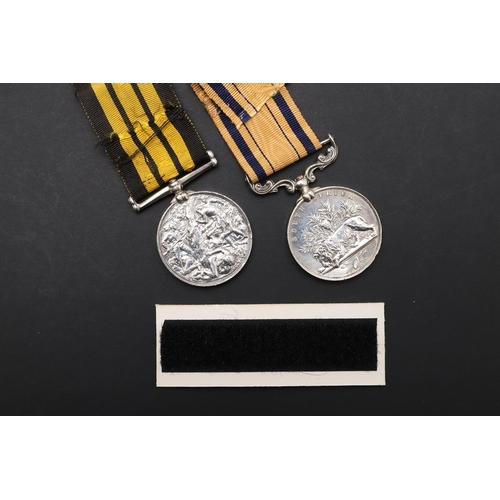 677 - AN ASHANTEE AND SOUTH AFRICA PAIR TO A MUSICIAN ABOARD H.M.S. ACTIVE. An Ashantee Medal 1873-1874 na... 