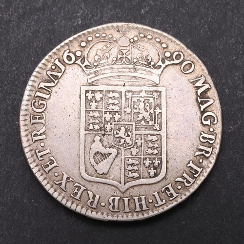 1502 - A WILLIAM AND MARY HALFCROWN, 1690. First busts r. Reverse with second crowned shield, dated 1690. R... 