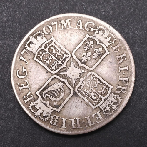 1509 - A QUEEN ANNE HALFCROWN, 1707. Draped bust l, with E below for the Edinburgh mint, Reverse with crown... 