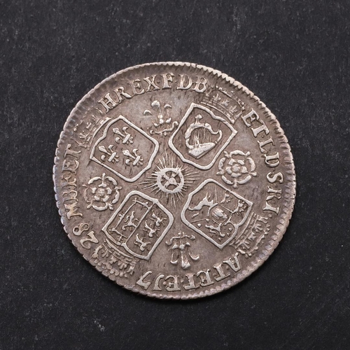 1514 - A GEORGE II SIXPENCE, 1728. Young laureate and draped bust l. Reverse with crowned cruciform shields... 