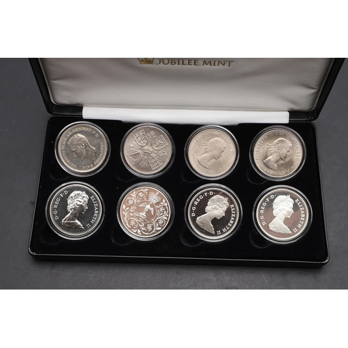 1587 - A JUBILEE MINT CROWN COLLECTION 1951 - 1981. A cased presentation collection of Crowns for 1951, 195... 