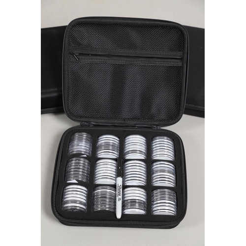 1599 - THREE COIN CASES, EACH CONTAINING 96 CAPSULES. A set of three 'soft-shell' coin cases in black, fitt... 