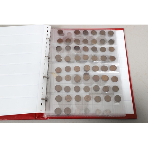 1628 - AN ALBUM OF COINS COMPRISING SOUVENIR CROWNS, FARTHINGS AND FIVE POUND COINS. An album containing Si... 