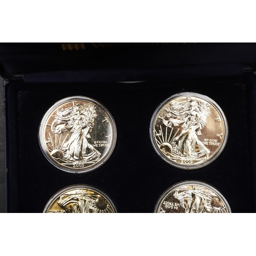 1643 - A WESTMINSTER MINT FOUR COIN GILT DOLLAR SET. A four coin set of gold plated 1 oz fine silver dollar... 