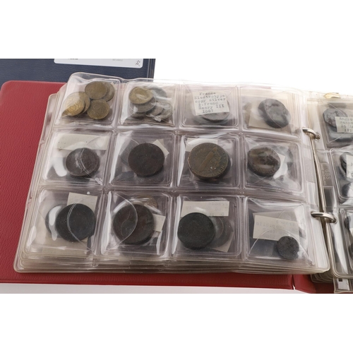 1664 - TWO ALBUMS OF WORLD COINS, THE MAJORITY SECOND HALF OF THE 19TH CENTURY AND LATER. Two albums contai... 