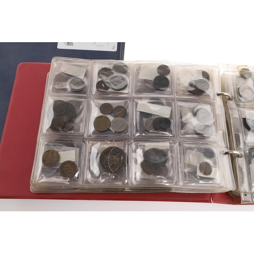 1664 - TWO ALBUMS OF WORLD COINS, THE MAJORITY SECOND HALF OF THE 19TH CENTURY AND LATER. Two albums contai... 