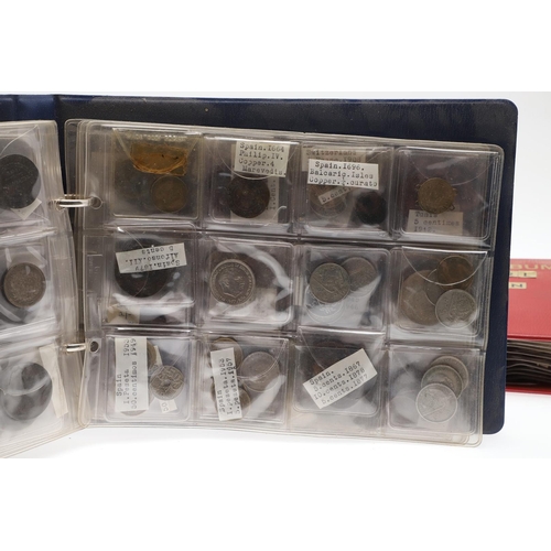 1664 - TWO ALBUMS OF WORLD COINS, THE MAJORITY SECOND HALF OF THE 19TH CENTURY AND LATER. Two albums contai... 