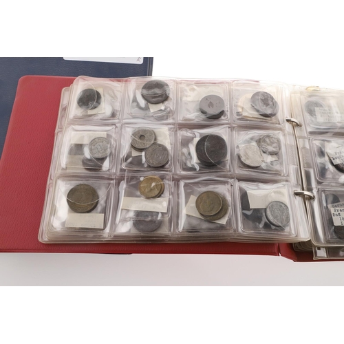 1664 - TWO ALBUMS OF WORLD COINS, THE MAJORITY SECOND HALF OF THE 19TH CENTURY AND LATER. Two albums contai... 