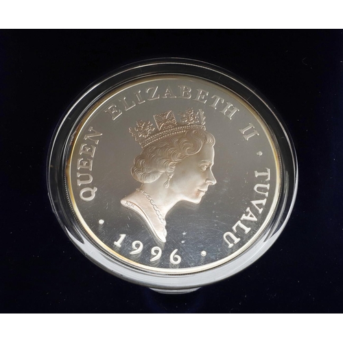 1667 - AN ELIZABETH II TUVALU 20 DOLLAR SILVER COIN. A 20 dollar silver coin, crowned bust r., reverse 'Que... 