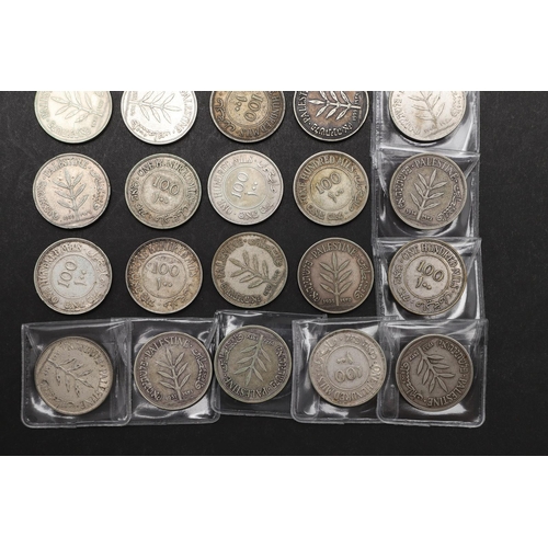 1695 - A COLLECTION OF PALESTINIAN 100 MILS COINS. Palestine coins from the British mandate period, 100 Mil... 