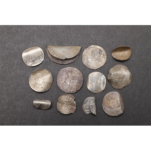 1810 - A COLLECTION OF TWELVE HAMMERED SILVER COINS, SOME BENT AS LOVE TOKENS, TO INCLUDE AN ELIZABETH I SH... 