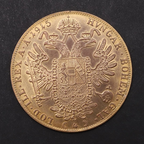 1968 - A RESTRIKE AUSTRIAN GOLD 4 DUCAT PIECE WITH DATE 1915, IN LIGHT MOUNT. Laureate bust of Franz Joseph... 