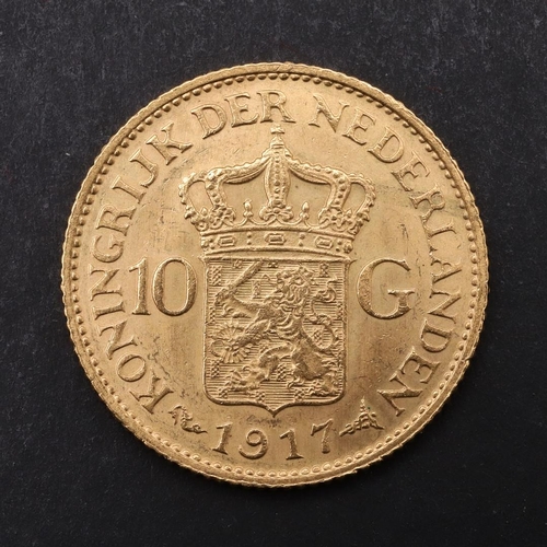 1970 - A QUEEN WILHELMINA GOLD 10 GUILDEN COIN, 1917. Crowned bust r. Reverse with crowned shield and value... 