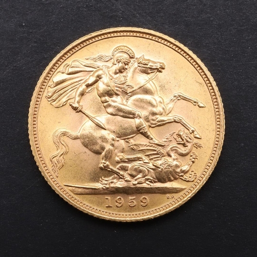 1983 - AN ELIZABETH II SOVEREIGN, 1959. An Elizabeth II Sovereign, bare head r. reverse George and the drag... 