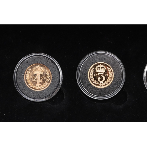 2034 - AN ELIZABETH II 2002 FOUR COIN GOLD MAUNDY SET. A 2002 Elizabeth II Golden Jubilee Maundy set in gol... 