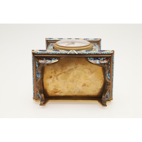 377 - AN EARLY 20TH CENTURY FRENCH GILT METAL AND CHAMPLEVE ENAMEL CLOCK. the white enamel dial painted wi... 