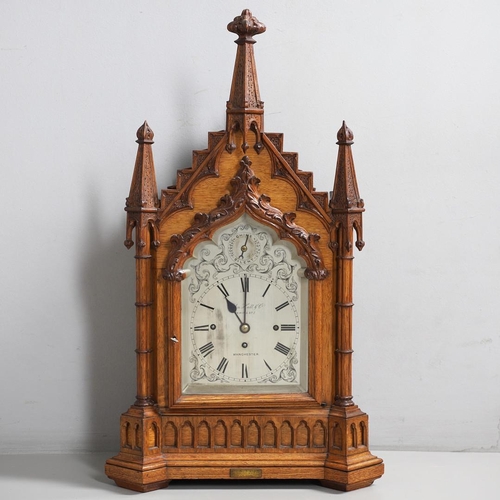 381 - A SUBSTANTIAL GOTHIC OAK CHIMING BRACKET CLOCK AND BRACKET. 19th century, the 7 3/4