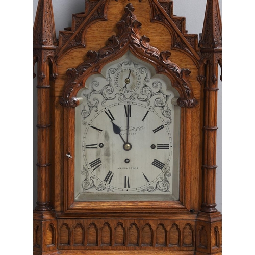 381 - A SUBSTANTIAL GOTHIC OAK CHIMING BRACKET CLOCK AND BRACKET. 19th century, the 7 3/4