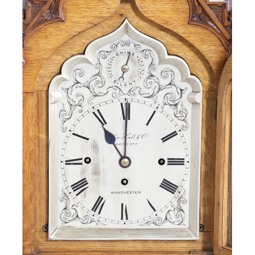 381 - A SUBSTANTIAL GOTHIC OAK CHIMING BRACKET CLOCK AND BRACKET. 19th century, the 7 3/4