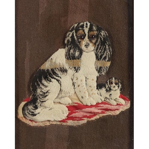 408 - A 19TH CENTURY RAISED WOOLWORK PICTURE. depicting a King Charles Spaniel and it's Puppy seated upon ... 