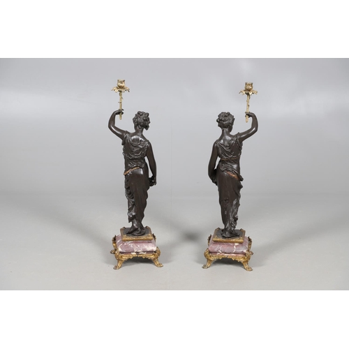 417 - A PAIR OF FRENCH SPELTER AND MARBLE TORCHERES. 19th century, modelled as Classical ladies holding al... 