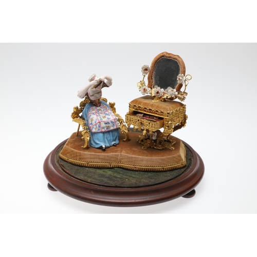 428 - AN UNUSUAL PORCELAIN FIGURE & GILT METAL DRESSING TABLE SEWING SET. 19th century, comprising of a se... 