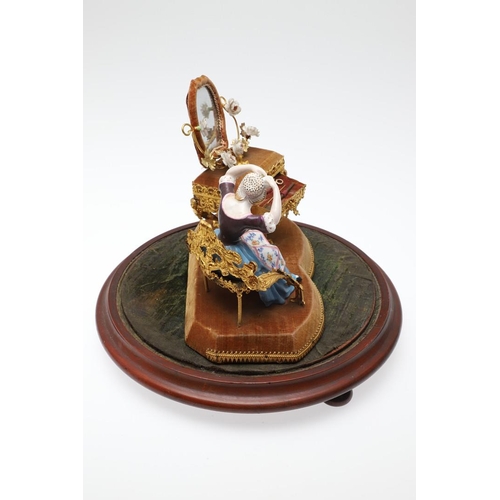 428 - AN UNUSUAL PORCELAIN FIGURE & GILT METAL DRESSING TABLE SEWING SET. 19th century, comprising of a se... 