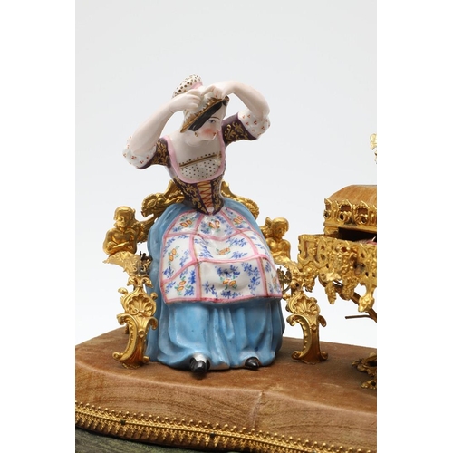 428 - AN UNUSUAL PORCELAIN FIGURE & GILT METAL DRESSING TABLE SEWING SET. 19th century, comprising of a se... 