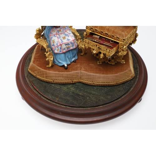 428 - AN UNUSUAL PORCELAIN FIGURE & GILT METAL DRESSING TABLE SEWING SET. 19th century, comprising of a se... 