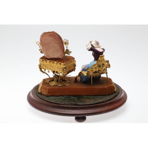 428 - AN UNUSUAL PORCELAIN FIGURE & GILT METAL DRESSING TABLE SEWING SET. 19th century, comprising of a se... 