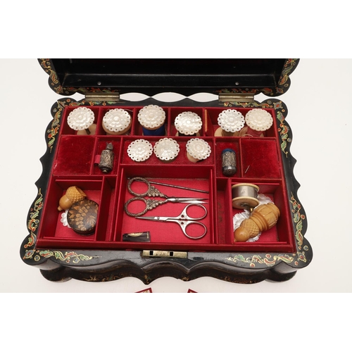 429 - A 19TH CENTURY EBONISED PAPER MACHE SEWING BOX AND CONTENTS. the hinged lid inset with painted mothe... 