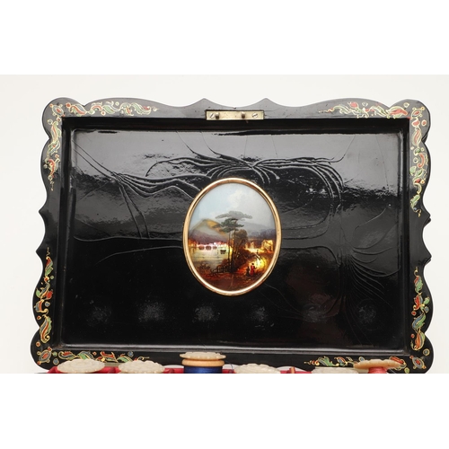 429 - A 19TH CENTURY EBONISED PAPER MACHE SEWING BOX AND CONTENTS. the hinged lid inset with painted mothe... 