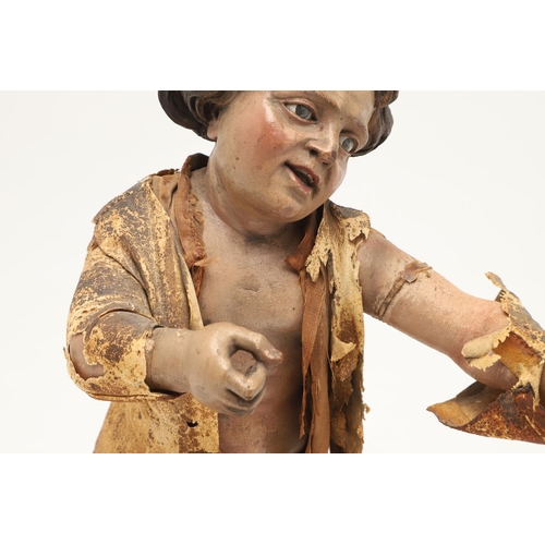 435 - AN ITALIAN CARVED SOFTWOOD FIGURE OF A BOY. possibly early 19th century, the semi-clothed figure mod... 