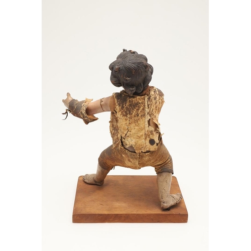 435 - AN ITALIAN CARVED SOFTWOOD FIGURE OF A BOY. possibly early 19th century, the semi-clothed figure mod... 