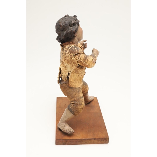 435 - AN ITALIAN CARVED SOFTWOOD FIGURE OF A BOY. possibly early 19th century, the semi-clothed figure mod... 