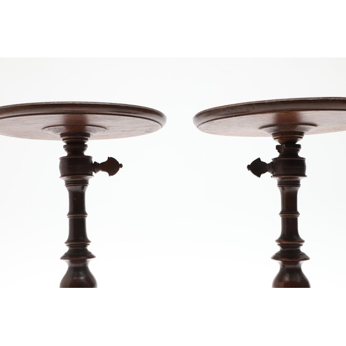 436 - A PAIR OF VICTORIAN ROSEWOOD CANDLE STANDS. with adjustable tops, turned stems and bases, height 21c... 