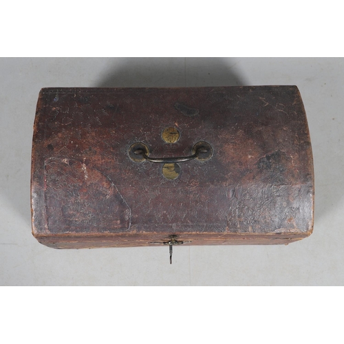 439 - A GEORGE III LEATHER COVERED DOCUMENTS TRAVEL TRUNK. embossed  with gilt crowns and foliate scroll d... 