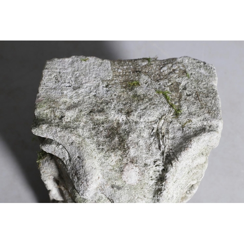 445 - A MEDIEVAL CARVED STONE CORBEL. depicting a grotesque, approx. 30cm high, 25cm wide x 24cm deep.