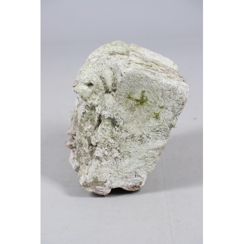 445 - A MEDIEVAL CARVED STONE CORBEL. depicting a grotesque, approx. 30cm high, 25cm wide x 24cm deep.