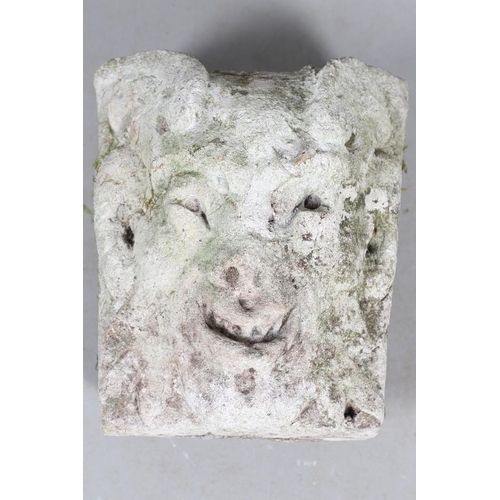 445 - A MEDIEVAL CARVED STONE CORBEL. depicting a grotesque, approx. 30cm high, 25cm wide x 24cm deep.