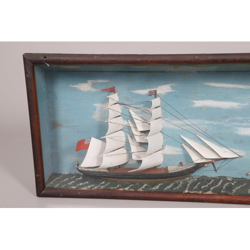 447 - A 19TH CENTURY SHIP DIORAMA. of a masted schooner and a smaller boat, with a painted background and ... 