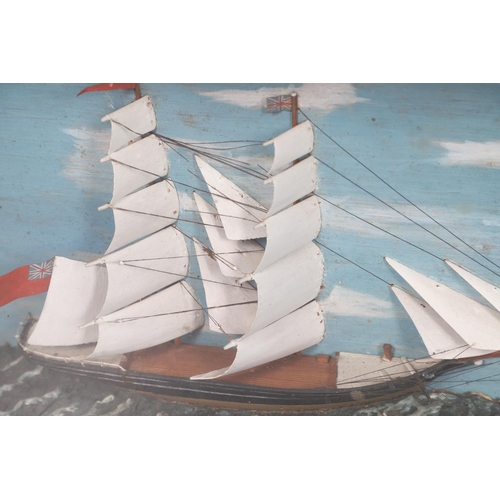 447 - A 19TH CENTURY SHIP DIORAMA. of a masted schooner and a smaller boat, with a painted background and ... 