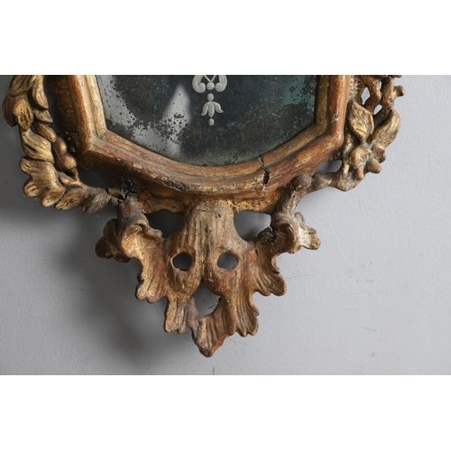 449 - A PAIR OF 18TH CENTURY VENETIAN GILTWOOD WALL MIRRORS. each glass panes etched with central semi-cla... 