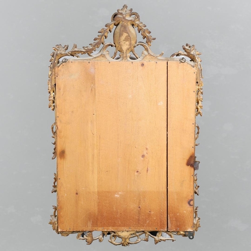 453 - A GEORGE III CARVED GILTWOOD AND GESSO WALL MIRROR. the elaborate cresting with ribbon tie surmounti... 