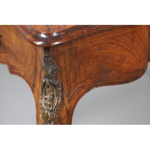 454 - A LOUIS XV STYLE BURR WALNUT AND MARQUETRY BUREAU PLAT. late 19th century, the shaped top with oval ... 