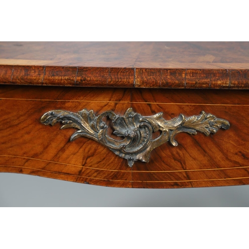 454 - A LOUIS XV STYLE BURR WALNUT AND MARQUETRY BUREAU PLAT. late 19th century, the shaped top with oval ... 